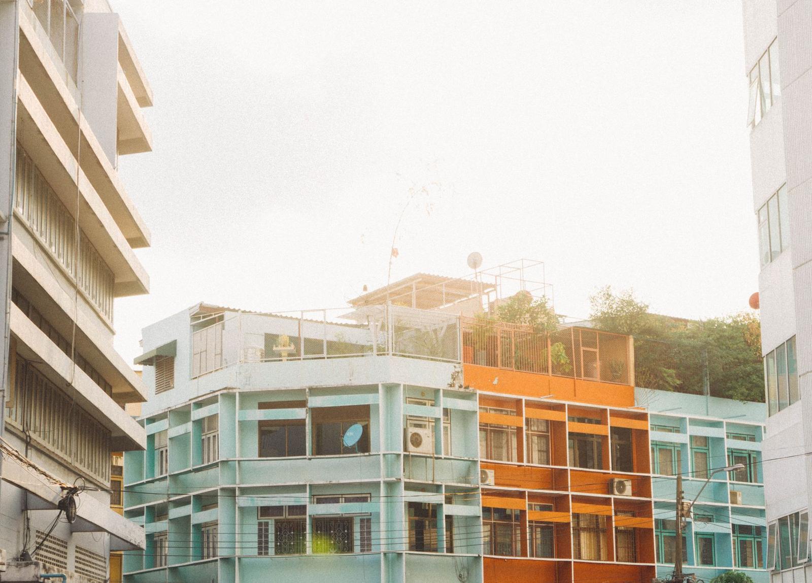 Teal Concrete Building near Trees